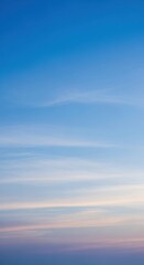 Obraz premium Serene Blue Sky with Wispy Clouds at Sunset