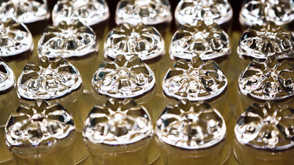 Glass goblets stand upside down rows.