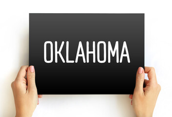 Oklahoma - is a landlocked state in the South Central region of the United States, text concept on card