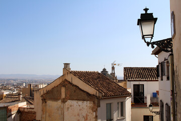Houses with Granada and mountain in the background, Spain, photographed in July 2024.
