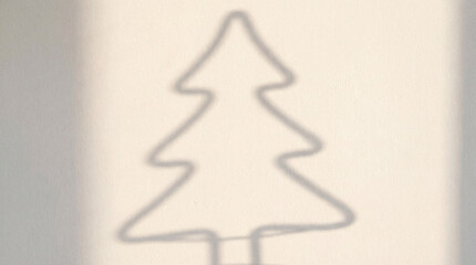 Vector illustration of a female figure holding a decorated Christmas tree, perfect for a winter holiday greeting card design