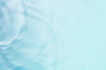 The clear blue surface of the water gradients from light to dark.