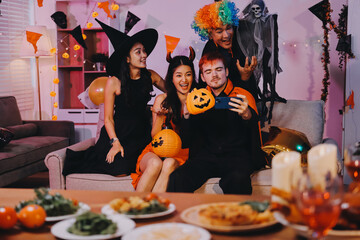 Joyful office Halloween party with coworkers in costumes, celebrating with drinks and laughter, fostering teamwork and festive spirit