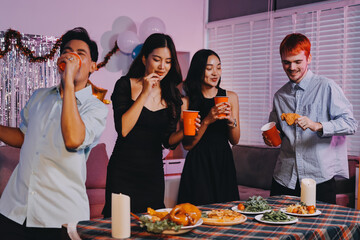 Diversity, dinner and group of people toast celebration together at party. Friends, happy and celebrate with food, wine and friendship for love, support and cheers champagne at business function