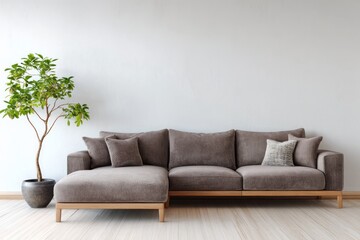 Modern sectional sofa with green potted plant in minimalist room.