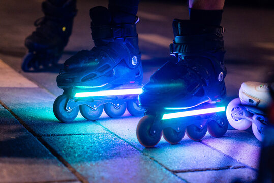 Sport skating rollers, close-up of roller boots sparkling in the night