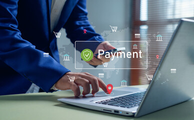 business person using a laptop and smartphone to make secure online payments, representing digital transactions, e-commerce, mobile banking, and global financial technology solutions.