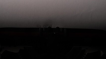 Vintage typewriter typing the classified word top secret onto a piece of white paper, conveying concepts of hidden information, suspense, and investigation - Powered by Adobe