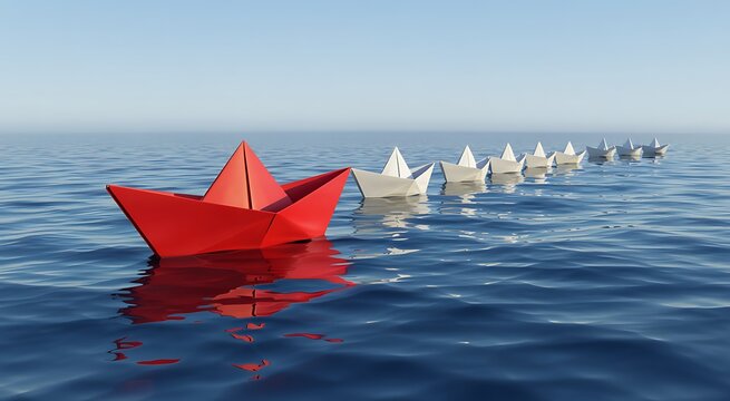 Bright red paper boat leads a long line of white paper boats sailing across a calm blue ocean under a clear sky