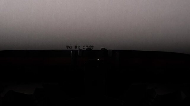 Paper with the message to be continued centered on a vintage typewriter, symbolizing narrative continuation, suspense, and the ongoing nature of stories, projects, and life events