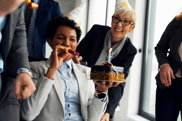 Business People Celebrating a Colleague's Birthday in the Office.