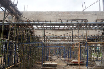 Scaffolding and formwork systems used to support concrete pouring.  