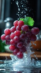 Vibrant Red Grapes Being Washed with Refreshing Water Splashes, Perfect for Healthy Food Promotions and Beverage Advertising