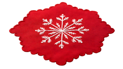 Festive red cloth napkin with white snowflake appliquÃ© and scalloped edge, isolated on white background