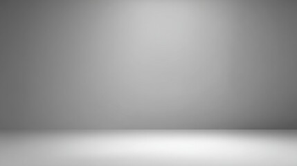 Empty minimalist studio space with soft lighting and smooth gradient wall creating a serene atmosphere for photography or artistic displays