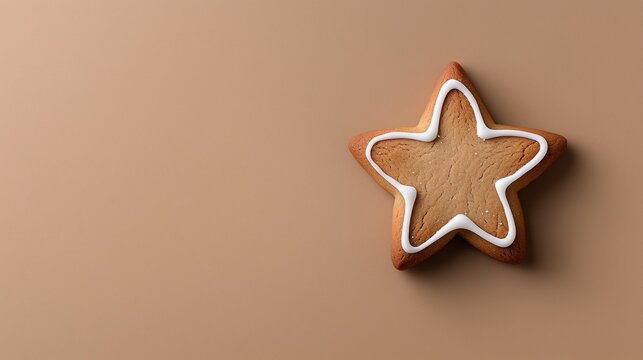 Gingerbread star cookie decorated with icing on a neutral background