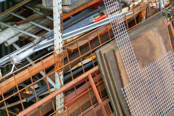 Abstract Textured Background of Rusted Scrap Metal Pipes Mesh Construction Debris