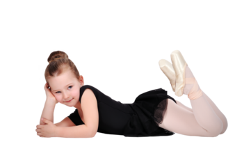 Young girl in ballet pose wearing black tutu a