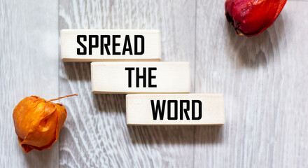 SPREAD THE INFORMATION text on wooden blocks