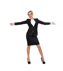 A business woman stands in a black formal suit with her arms spread out to the sides.
