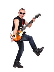 Emotional rock musician playing electric guitar in jeans and a T-shirt