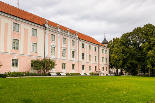 Pink historic palace with garden lawn in Tallinn, Estonia.