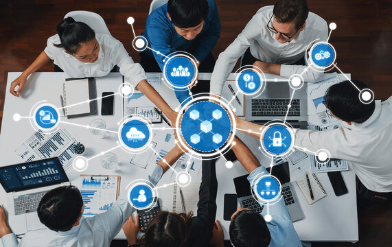 Top view diverse office worker join hand together in office room symbolize business synergy and strong productive teamwork in workplace. Cooperation and unity between business employee. Prudent Amity