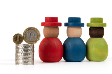 Coins of 1 and 100 Kazakhstani tenge and wooden people