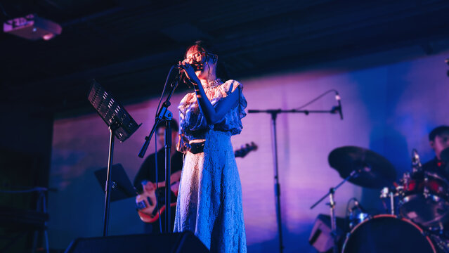 asian woman singer on stage good vibes live performance vocalist singing city pop music at live house - Powered by Adobe