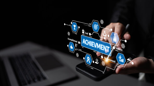 A pair of hands interacting with a smartphone displaying digital icons associated with achievement and success, signifying modern business aspirations and goals. Tessel