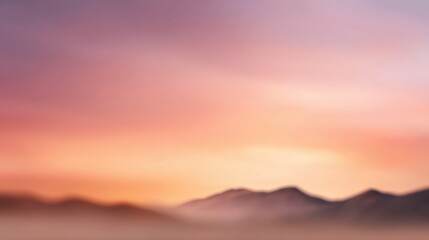 Obraz premium Serene Sunset Overblurred Mountain Landscape with Soft Pastel Colors in the Sky Evoking Calmness and Tranquility for Nature Enthusiasts and Photographers