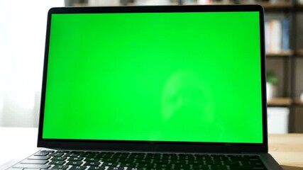 Laptop with green screen, perfect for demonstrating software applications tutorials or product