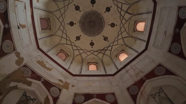 Interior Perspective of the Nila Gumbad (Blue Dome) Tomb, Capturing the Intricate Geometric Patterns and Artwork on the Ceiling Under Low Light, Highlighting Mughal-Era Heritage and Architecture