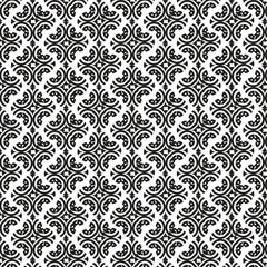 Intricate black and white damask pattern with repeating arabesque and floral motifs