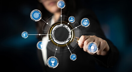 A business professional engages with a high-tech digital interface, showcasing various icons that symbolize innovation and connectivity across multiple sectors. Crux