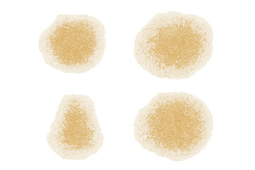 Four abstract textured yellow stains or powder piles isolated on white background