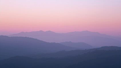 Obraz premium Mountain Range at Sunset with Vibrant Orange and Pink Hues