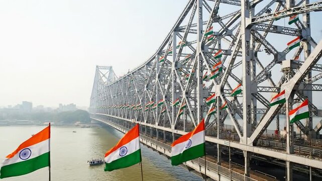 Howrah Bridge adorned with tricolor flags, a vibrant Indian landmark on independence day