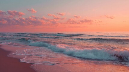 The setting sun casts warm hues across the sky and ocean as gentle waves lap at the sandy shore. This peaceful scene captures the tranquility of a beach at dusk.