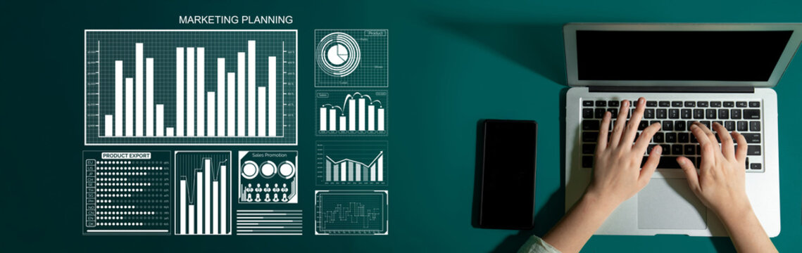 A top-down view of hands typing on a laptop, surrounded by visual marketing charts and graphs that illustrate strategic business planning and data analysis. Impute - Powered by Adobe