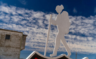 Figure of a hiker against blue sky 
