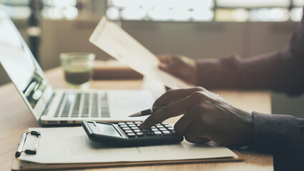 Businessman planning budget in office