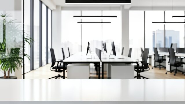 Modern, bright, openplan office interior with multiple workstations, computers, ergonomic chairs, large windows, minimalist design, and a clean white foreground