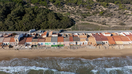 Close aerial view of beachfront fishermen homes in Guardamar, Spain