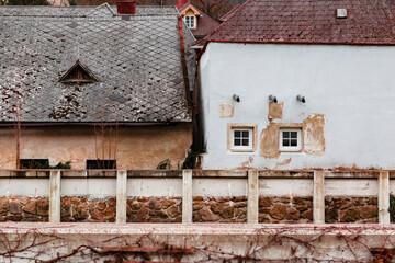 Old Rustic Houses With Weathered Facades and Stone Wall