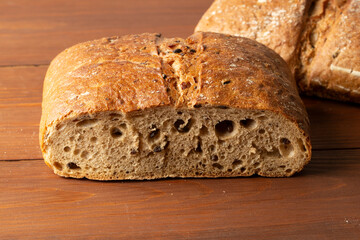 Whole grain bread on a wooden background