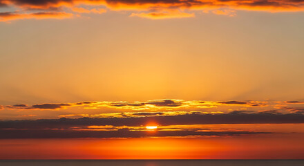 Vibrant Orange Sunset with Rays of Light Breaking Through Clouds Over Ocean Creating Dramatic and Colorful Sky at Dusk with Beautiful View 150