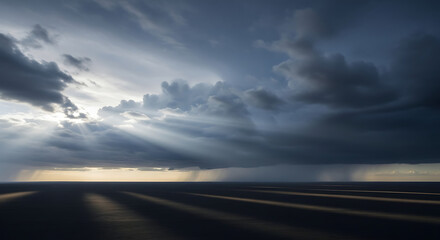 Dramatic Rain Clouds with Sun Rays Breaking Through Create a Striking Contrast and Atmospheric Perspective Over Water Body