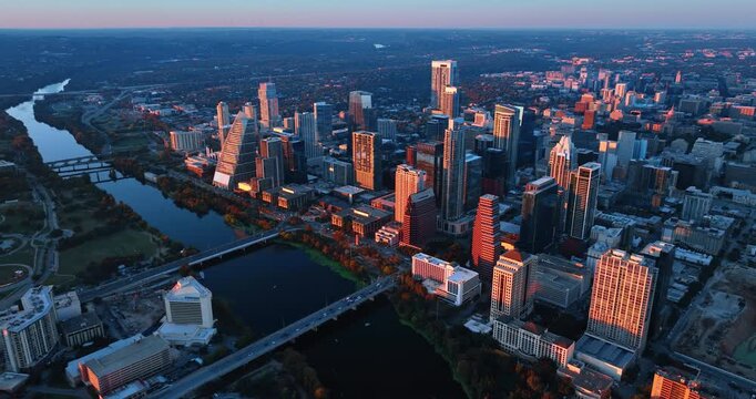 Modern downtown of Austin, Texas, USA in the light of sunset. Distancing from the Colorado River crossing the city.
