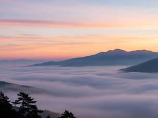 Obraz premium Scenic Mountain Landscape with Sunrise Sky and Misty Fog in Forested Area